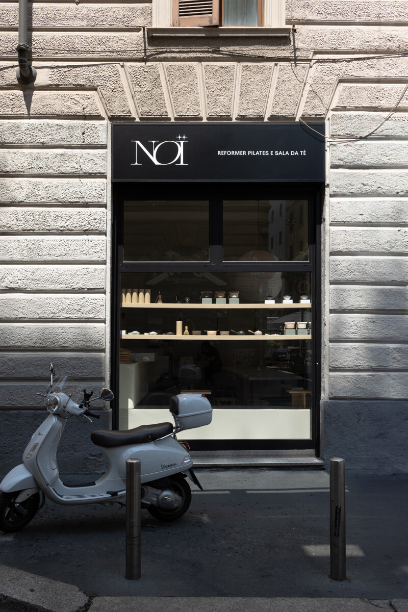 Graphic of a typography specimen showing the alphabet and numerals on top of a dark gray background.