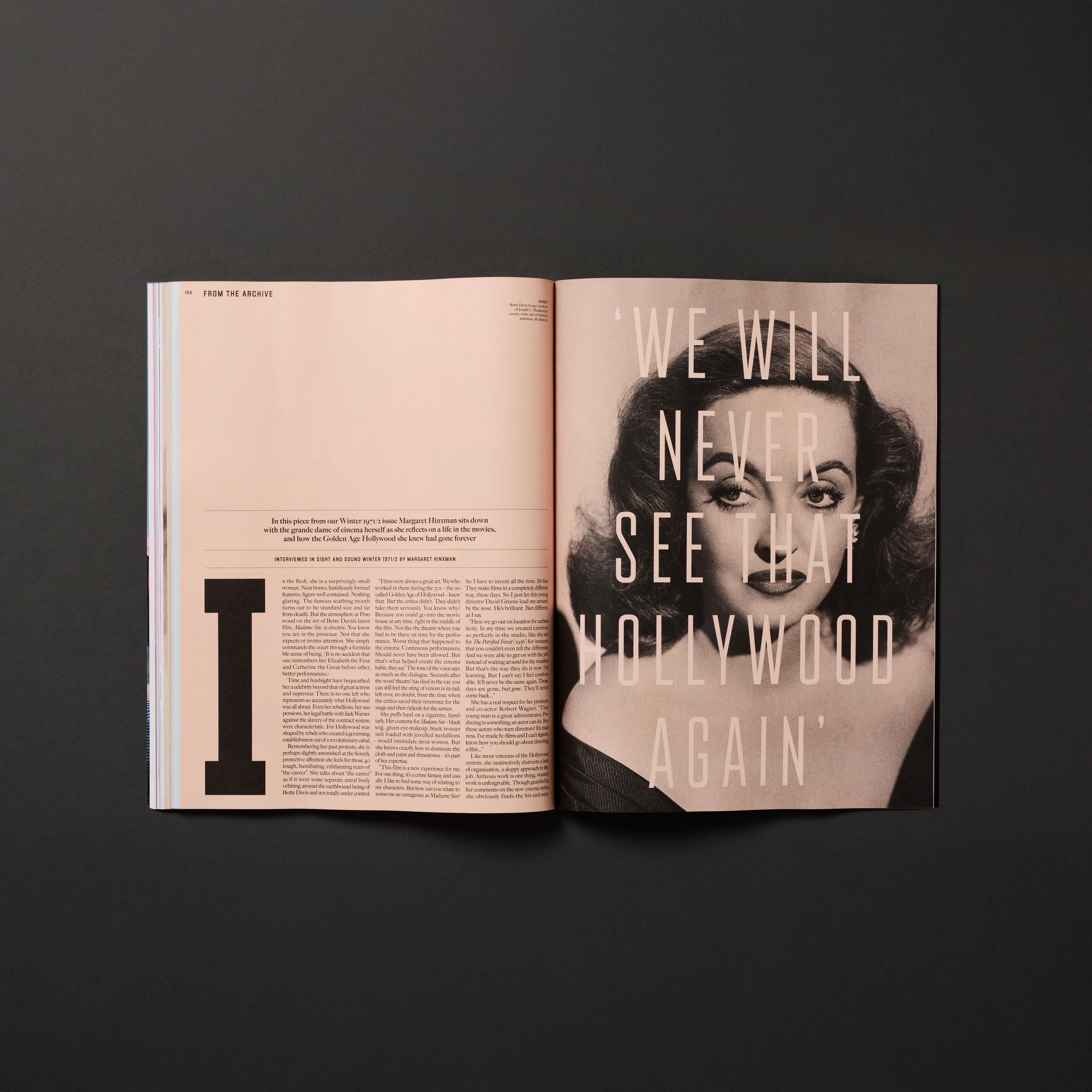 Graphic of a typography specimen showing the alphabet and numerals on top of a dark gray background.