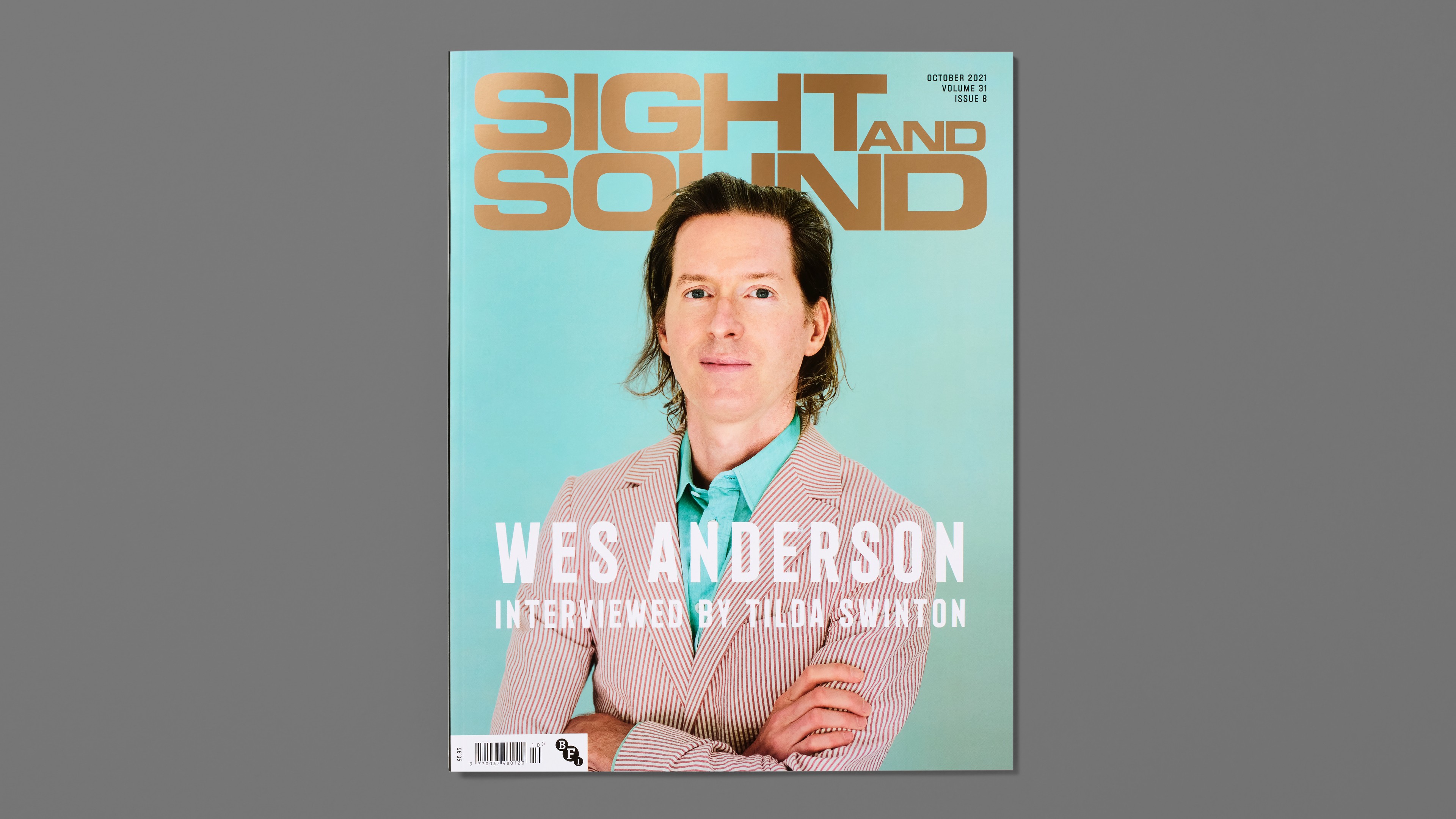 Graphic of a typography specimen showing the alphabet and numerals on top of a dark gray background.