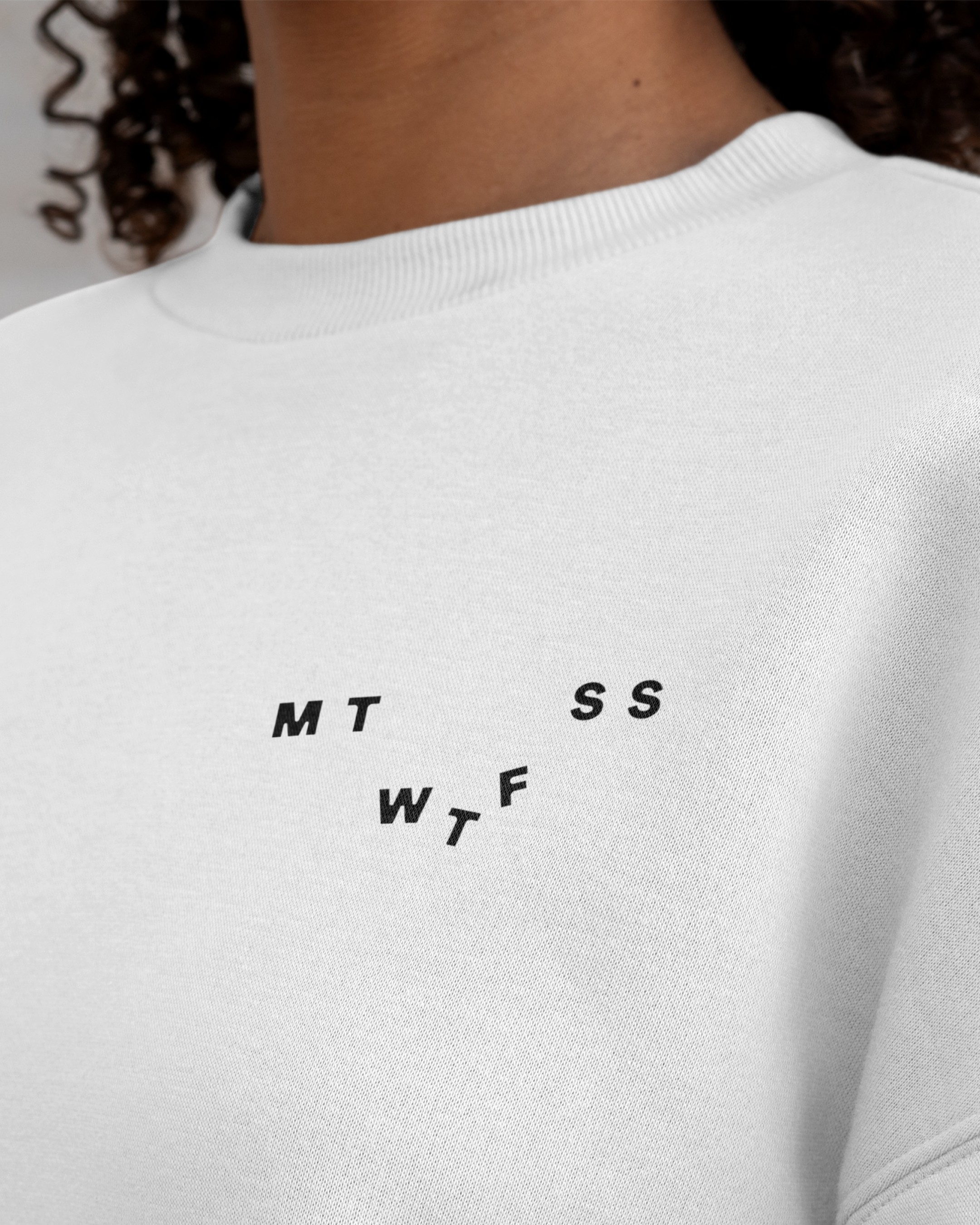 Graphic of a typography specimen showing the alphabet and numerals on top of a dark gray background.